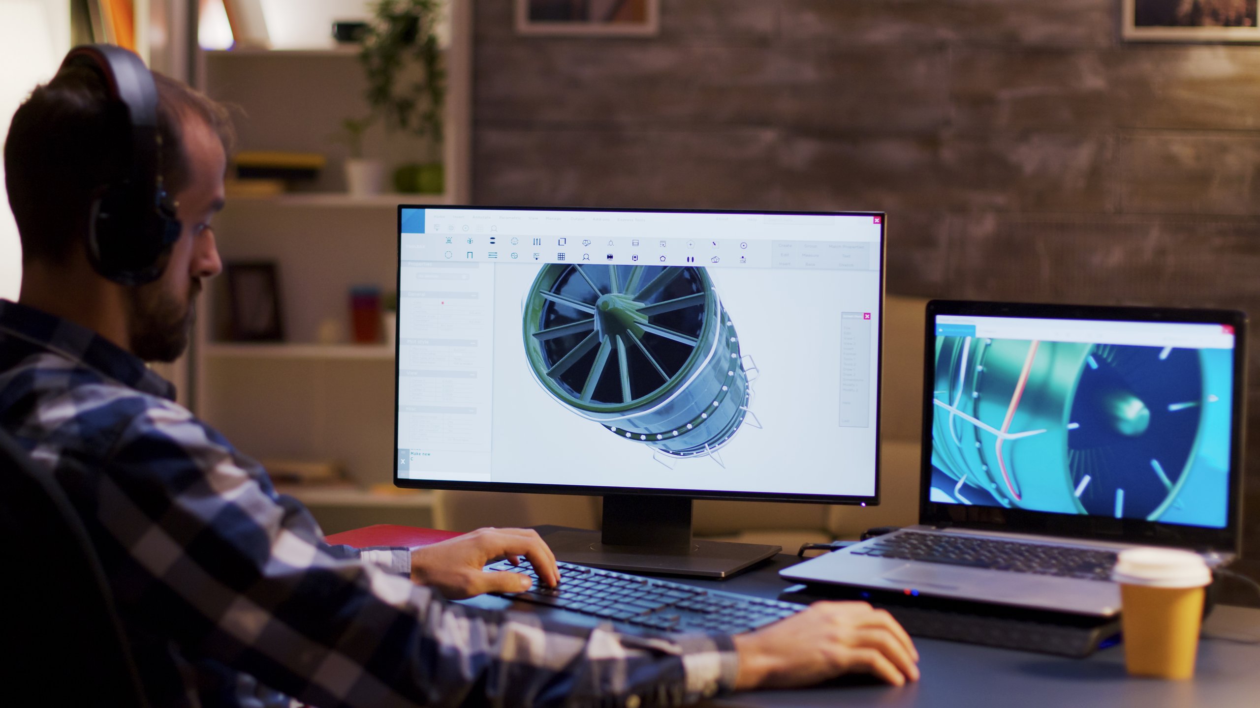 Worker designing aerospace part